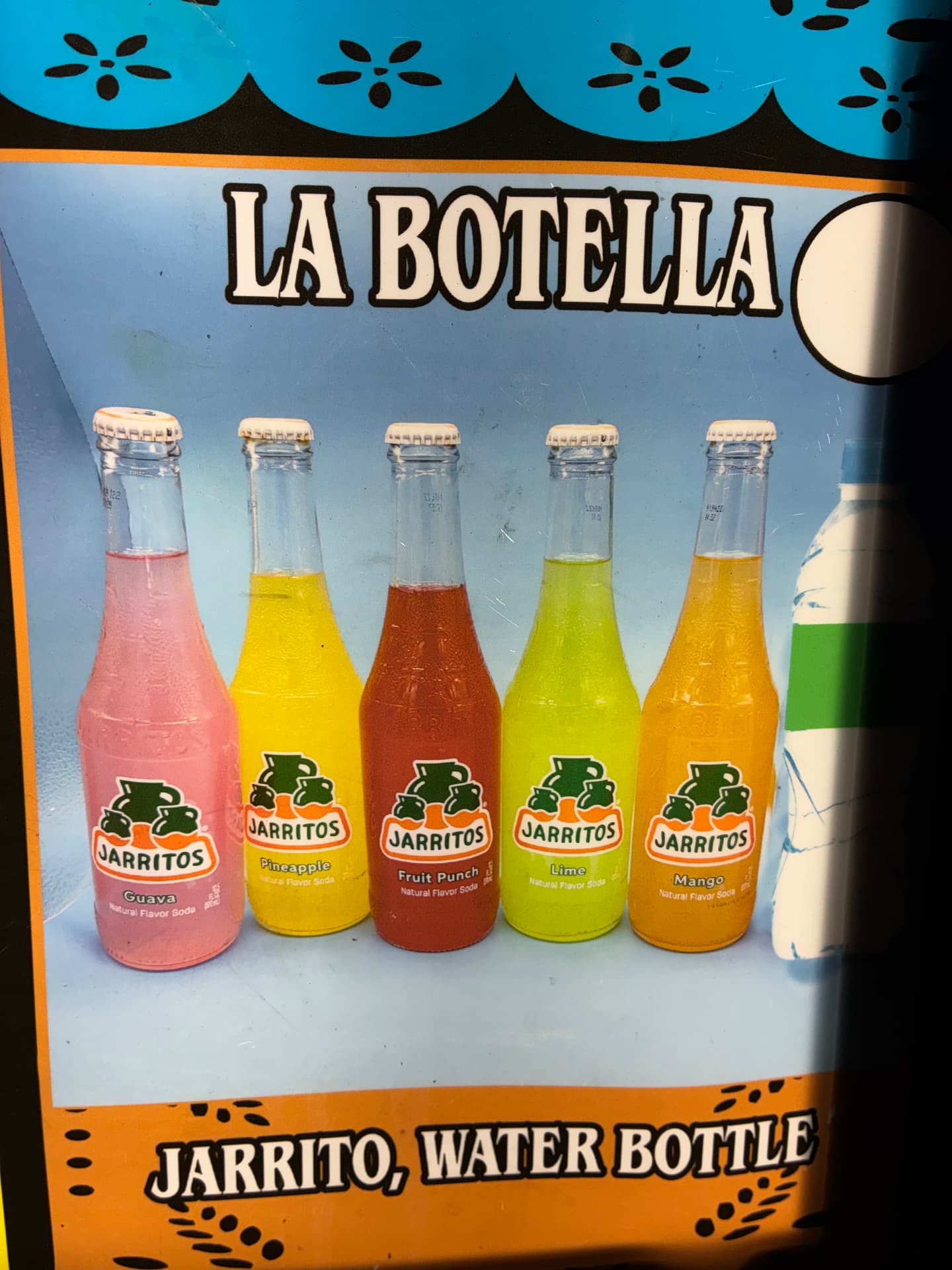 Colorful glass bottles of Jarritos